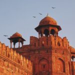 Delhi tour packages India gateway city travel India Gate Delhi night view tourism Red Fort Delhi historical monument tour Qutub Minar UNESCO heritage site Delhi Lotus Temple Delhi architecture travel spot Delhi sightseeing tour package FlixHoly Delhi family holiday package India capital Old Delhi Chandni Chowk food tour Premium Delhi travel package cab sightseeing FlixHoly Delhi holiday packages booking