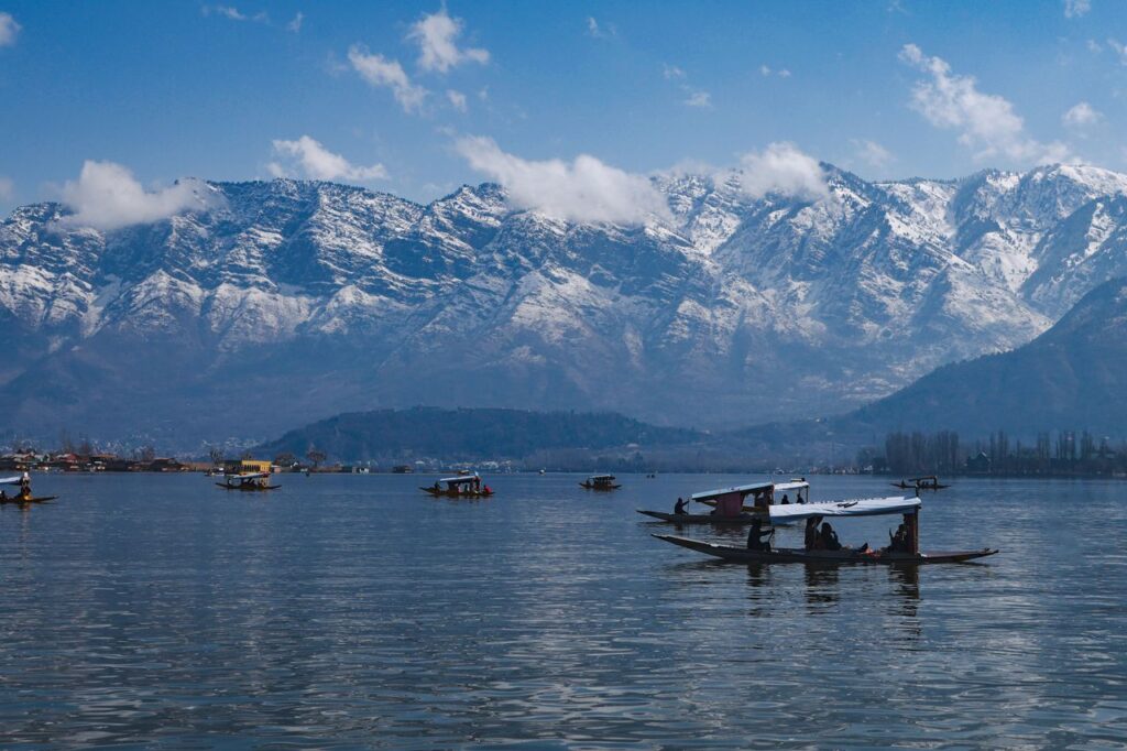 Best Kashmir tour packages Srinagar Dal Lake shikara ride Gulmarg snow mountain gondola cable car Kashmir travel Pahalgam valley river scenic landscape Kashmir holiday Kashmir honeymoon couple snow romantic trip India Family Kashmir tour package Srinagar Gulmarg Pahalgam Mughal gardens Srinagar Nishat Bagh Shalimar Bagh Kashmir winter snowfall tourism paradise India travel Budget and luxury Kashmir holiday packages FlixHoly Kashmir sightseeing tour package premium hotels cab FlixHoly Kashmir travel booking India holiday package