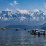 Best Kashmir tour packages Srinagar Dal Lake shikara ride Gulmarg snow mountain gondola cable car Kashmir travel Pahalgam valley river scenic landscape Kashmir holiday Kashmir honeymoon couple snow romantic trip India Family Kashmir tour package Srinagar Gulmarg Pahalgam Mughal gardens Srinagar Nishat Bagh Shalimar Bagh Kashmir winter snowfall tourism paradise India travel Budget and luxury Kashmir holiday packages FlixHoly Kashmir sightseeing tour package premium hotels cab FlixHoly Kashmir travel booking India holiday package