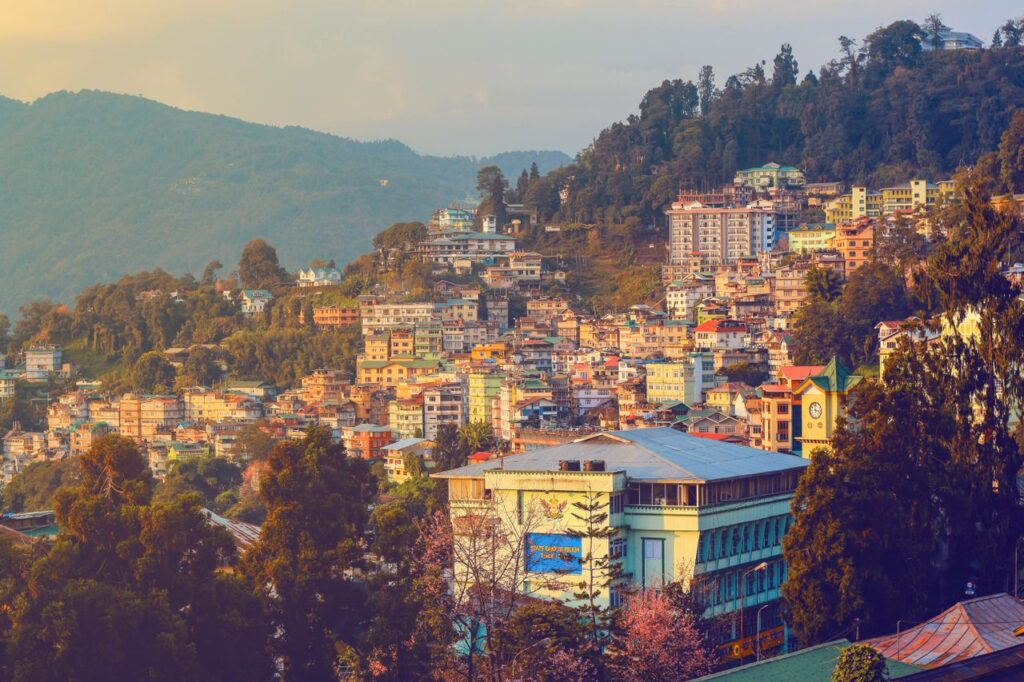 North East tour packages India scenic mountains Meghalaya Shillong Cherrapunji waterfalls tour Kaziranga National Park Assam wildlife safari Gangtok Sikkim Himalayan view holiday package Dawki river crystal clear water Meghalaya boating North East family holiday package FlixHoly North East couple honeymoon tour India hills Seven Sisters India travel destinations map Premium North East India travel itinerary FlixHoly North East tour packages booking